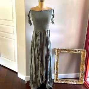 Summer beach dress with ruched bodice and wrap-style skirt. Little sleeve cap.